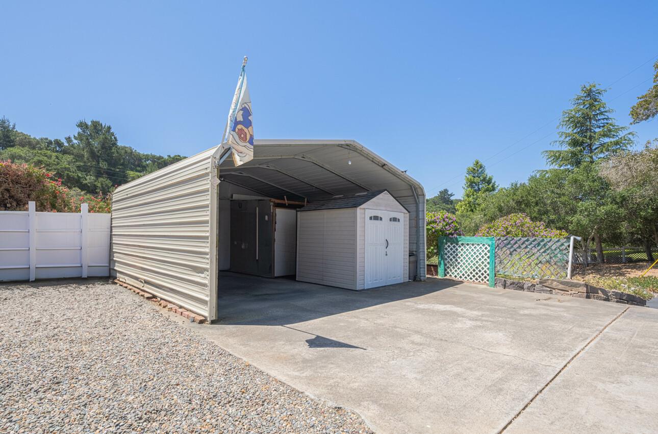 18101 Berta Canyon Road Salinas, CA 93907 - Photo 30 of 32 a view of a house with a backyard and a small cabin