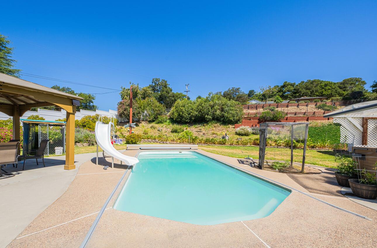 18101 Berta Canyon Road Salinas, CA 93907 - Photo 3 of 32 a view of a swimming pool with a patio and a yard