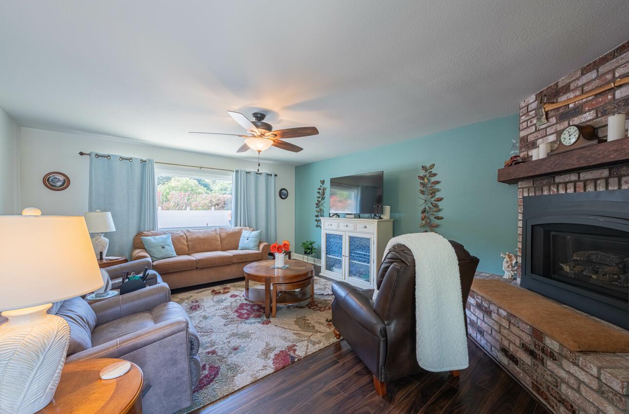 18101 Berta Canyon Road Salinas, CA 93907 - Photo 7 of 32 a living room with furniture and a fireplace