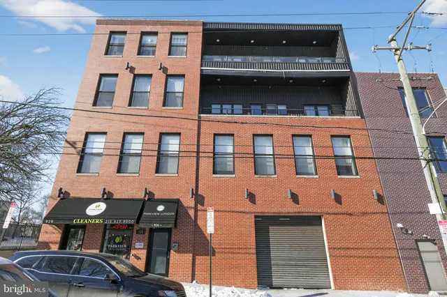 a front view of a building with many windows