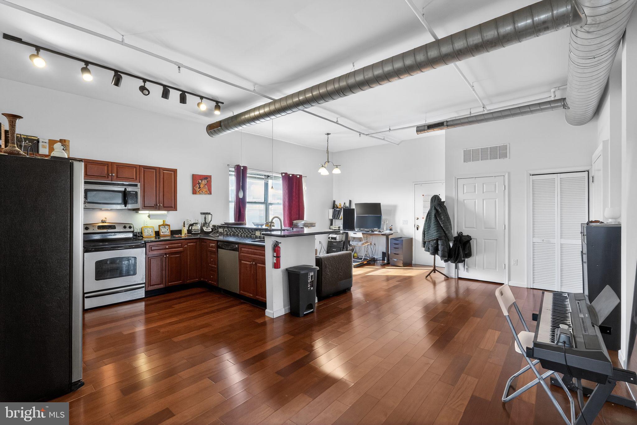 926 North 3rd Street, Unit 4D Philadelphia, PA 19123 - Photo 5 of 15 a large kitchen with lots of counter space a sink appliances and cabinets