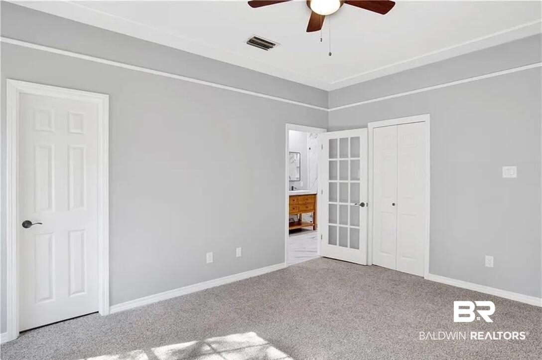 632 Ridgewood Drive Daphne, AL 36526 - Photo 29 of 36 Spare room with carpet floors and ceiling fan