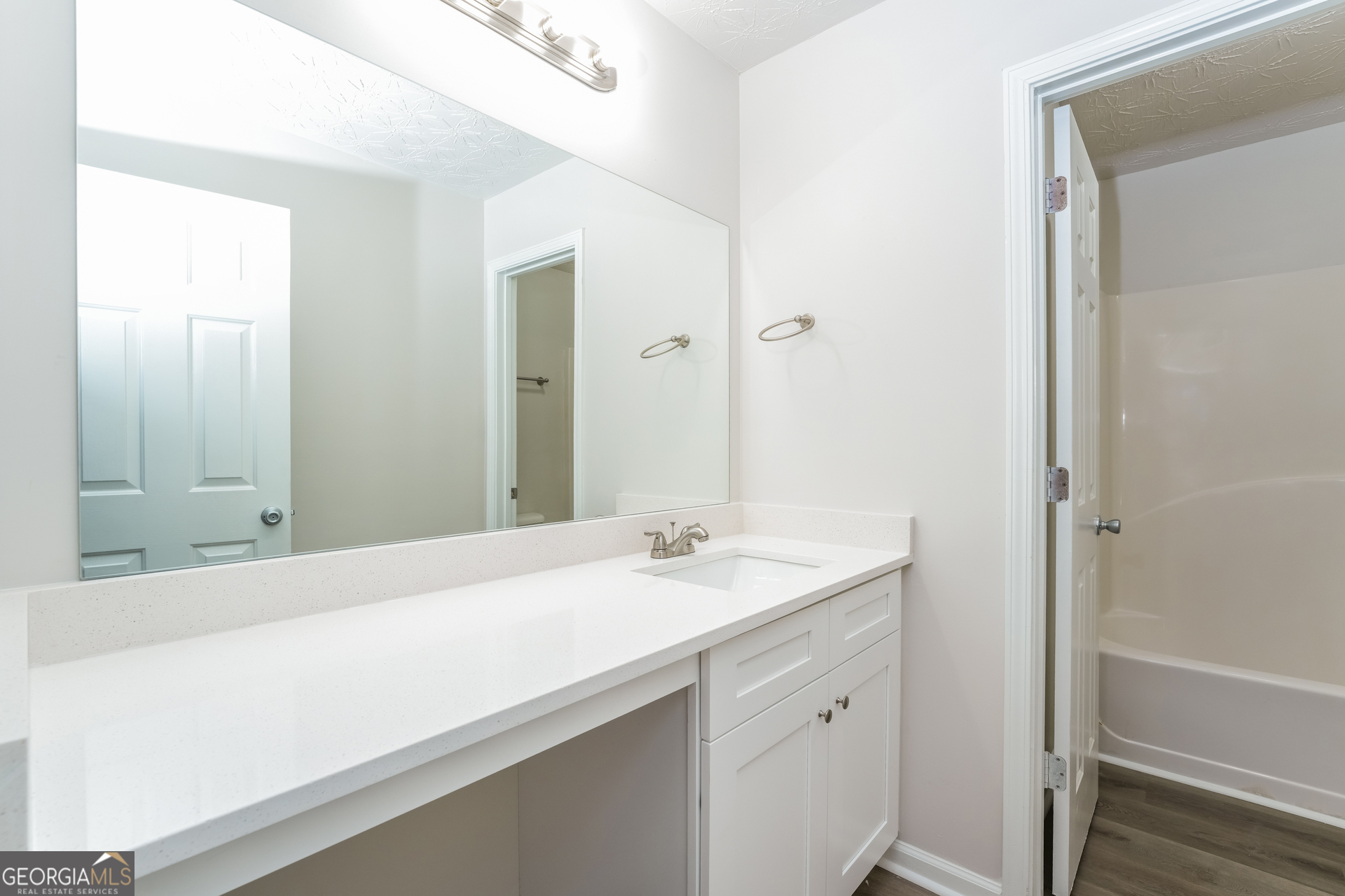 15 Emerson Trail Covington, GA 30016 - Photo 13 of 17 a bathroom with a sink and a mirror