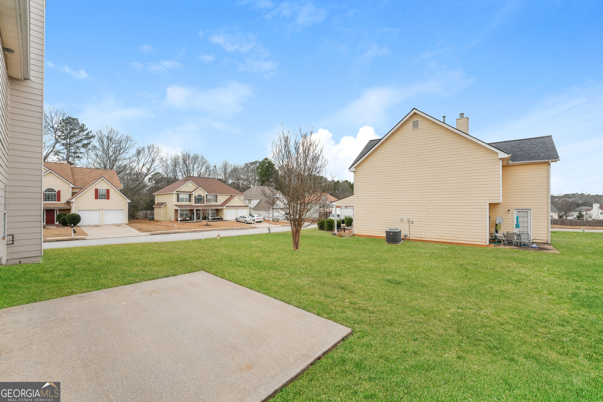 15 Emerson Trail Covington, GA 30016 - Photo 15 of 17 a view of a house with a yard and a garden