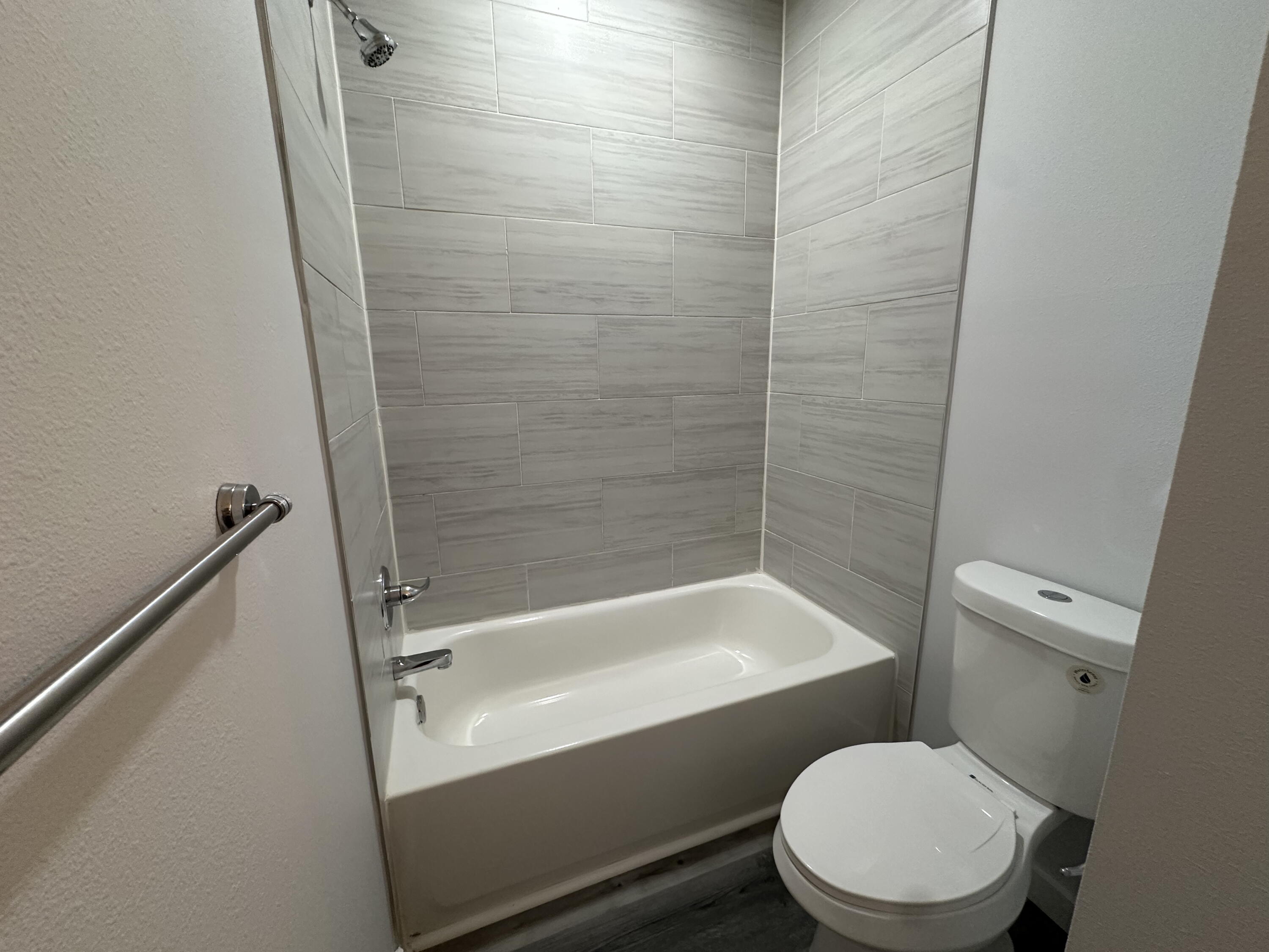 534 North Raphael Road DeFuniak Springs, FL 32433 - Photo 18 of 20 a white toilet sitting next to a bath tub