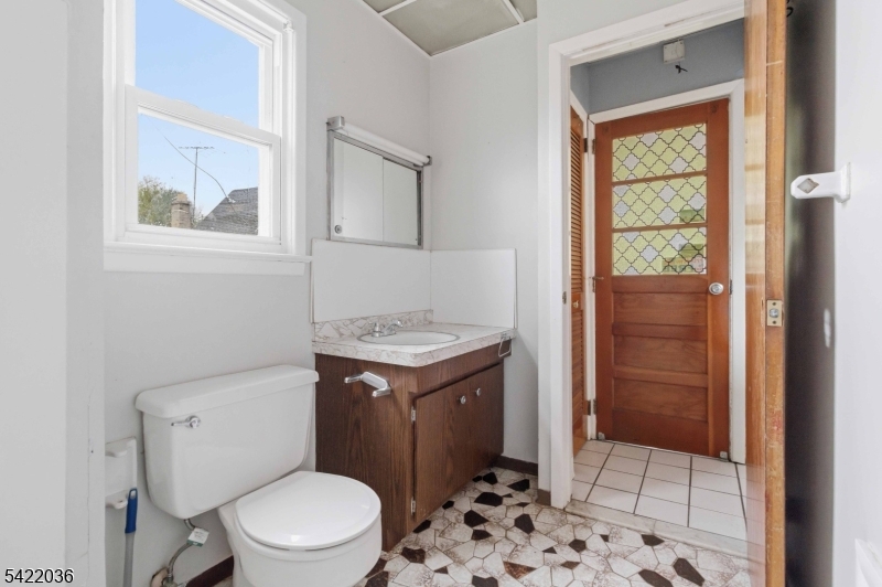 36 Edison Street Bloomfield, NJ 07003 - Photo 16 of 28 a bathroom with a sink a toilet and shower