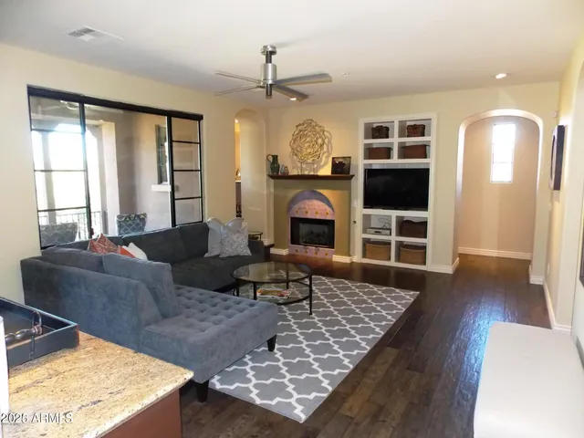 a living room with furniture rug and window