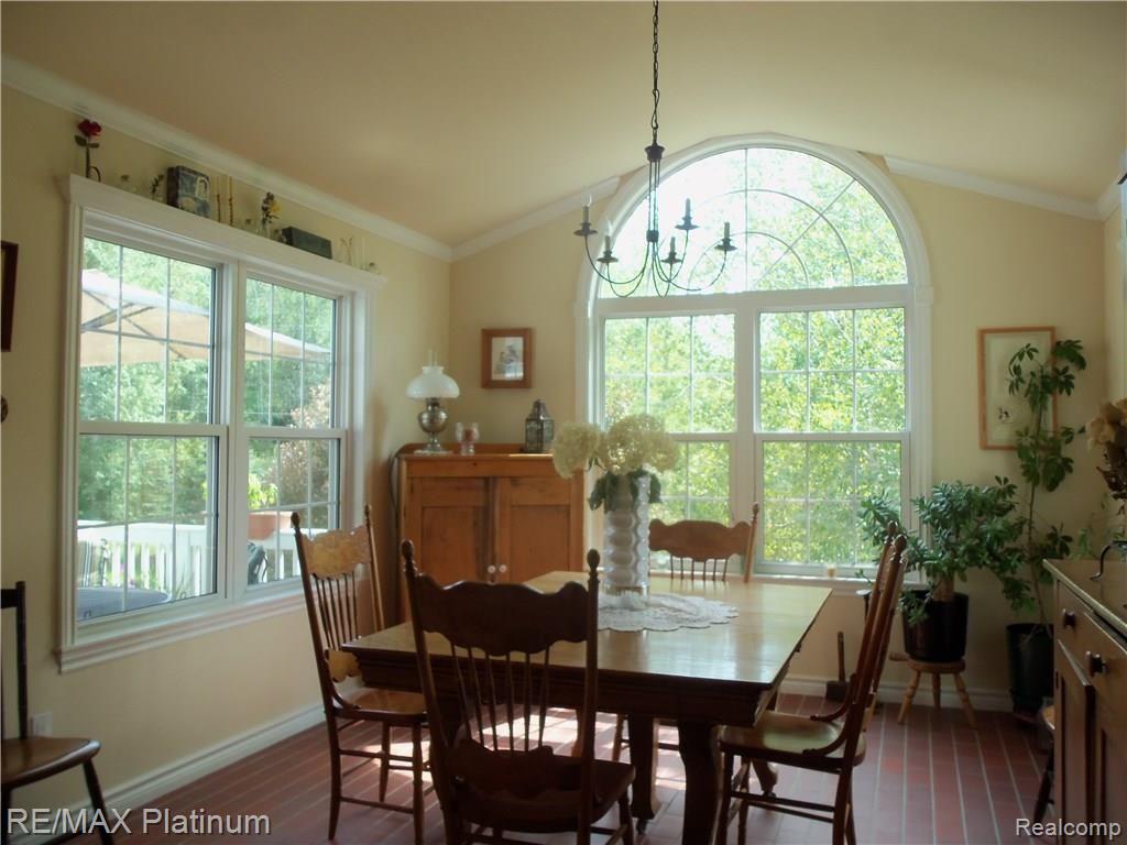 9906 Bergin Road Howell, MI 48843 - Photo 15 of 31 BRIGHT DINING ROOM BRICK FLOORS!