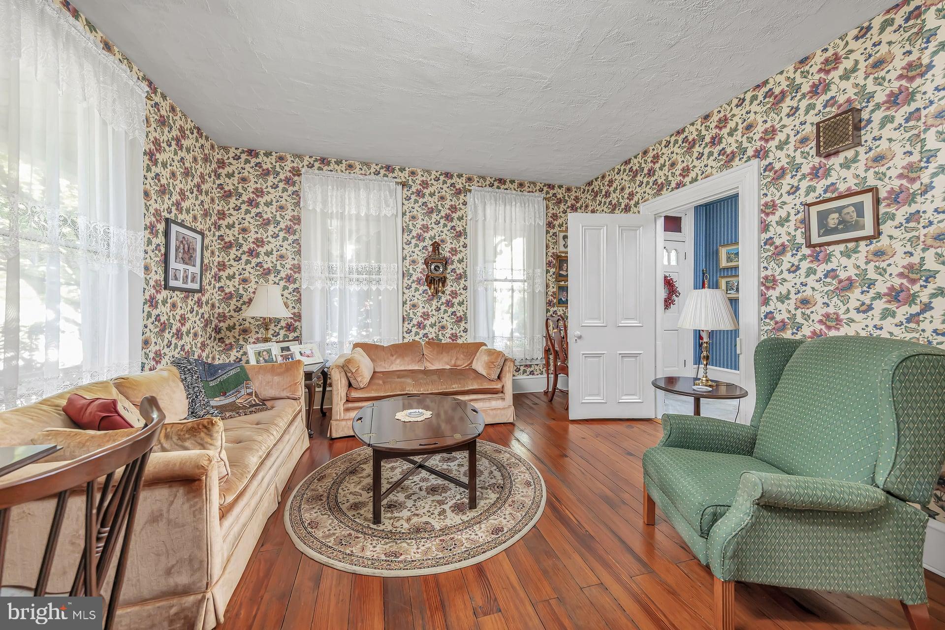 75 North Main Street Mullica Hill, NJ 08062 - Photo 9 of 35 a living room with furniture and a large window