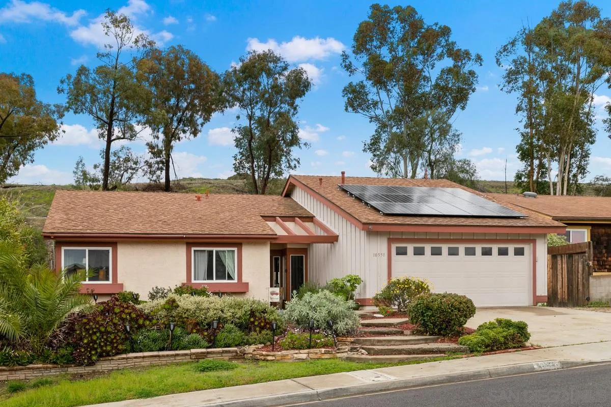 10551 Cadwell Road Santee, CA 92071 - Photo 3 of 32 a front view of a house with a yard and potted plants
