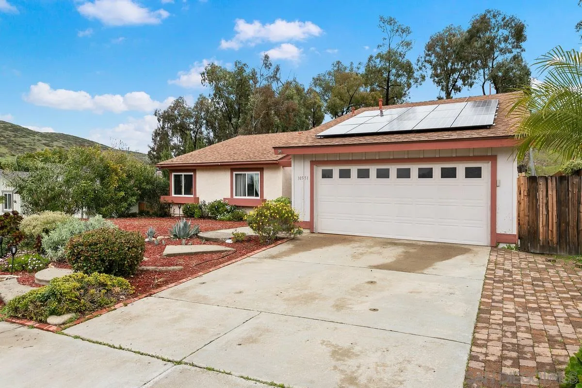 10551 Cadwell Road Santee, CA 92071 - Photo 5 of 32 a front view of a house with a yard