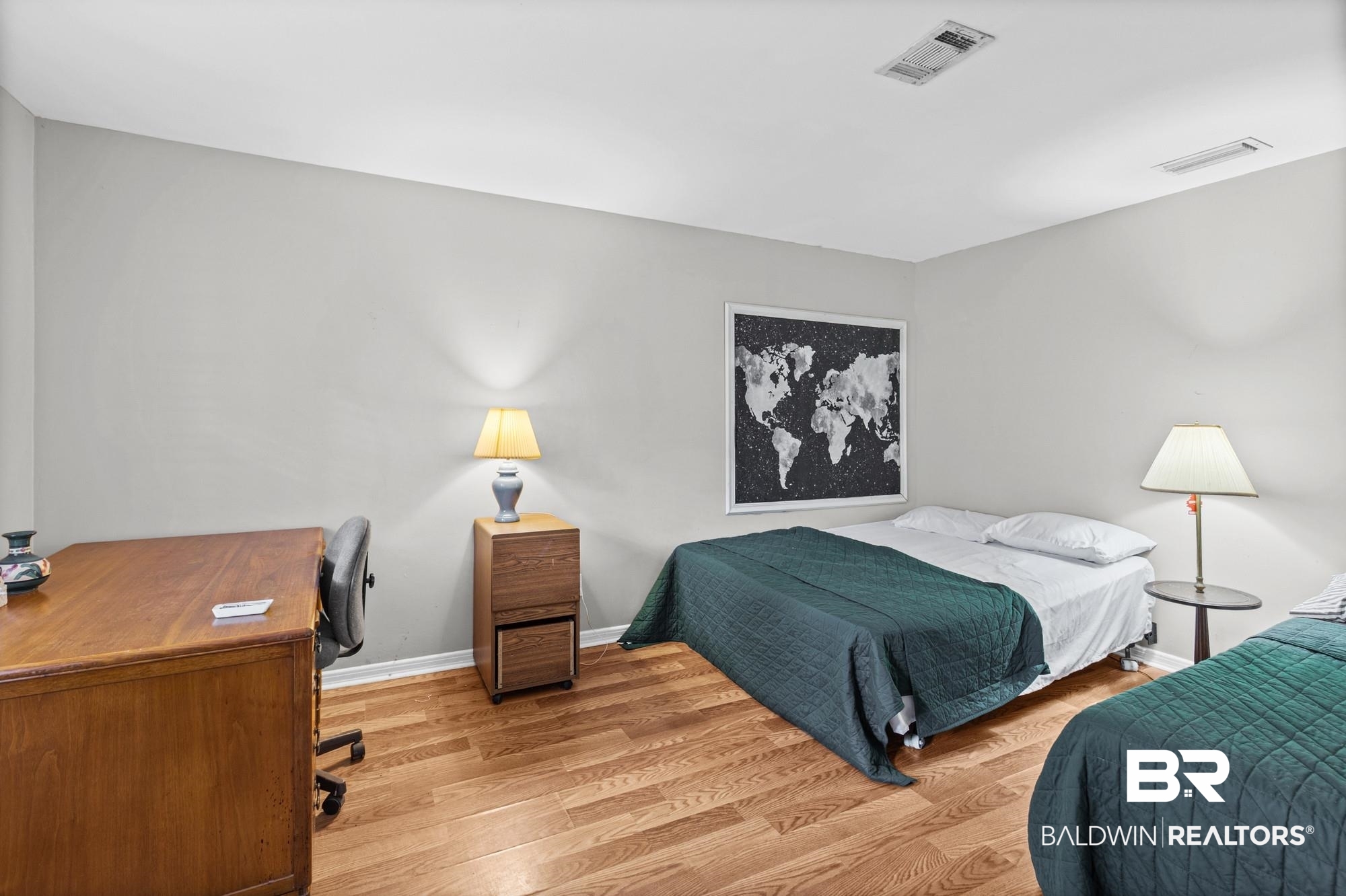 5510 Richmond Road Mobile, AL 36608 - Photo 14 of 21 Spacious room featuring wood-finish flooring and light gray walls