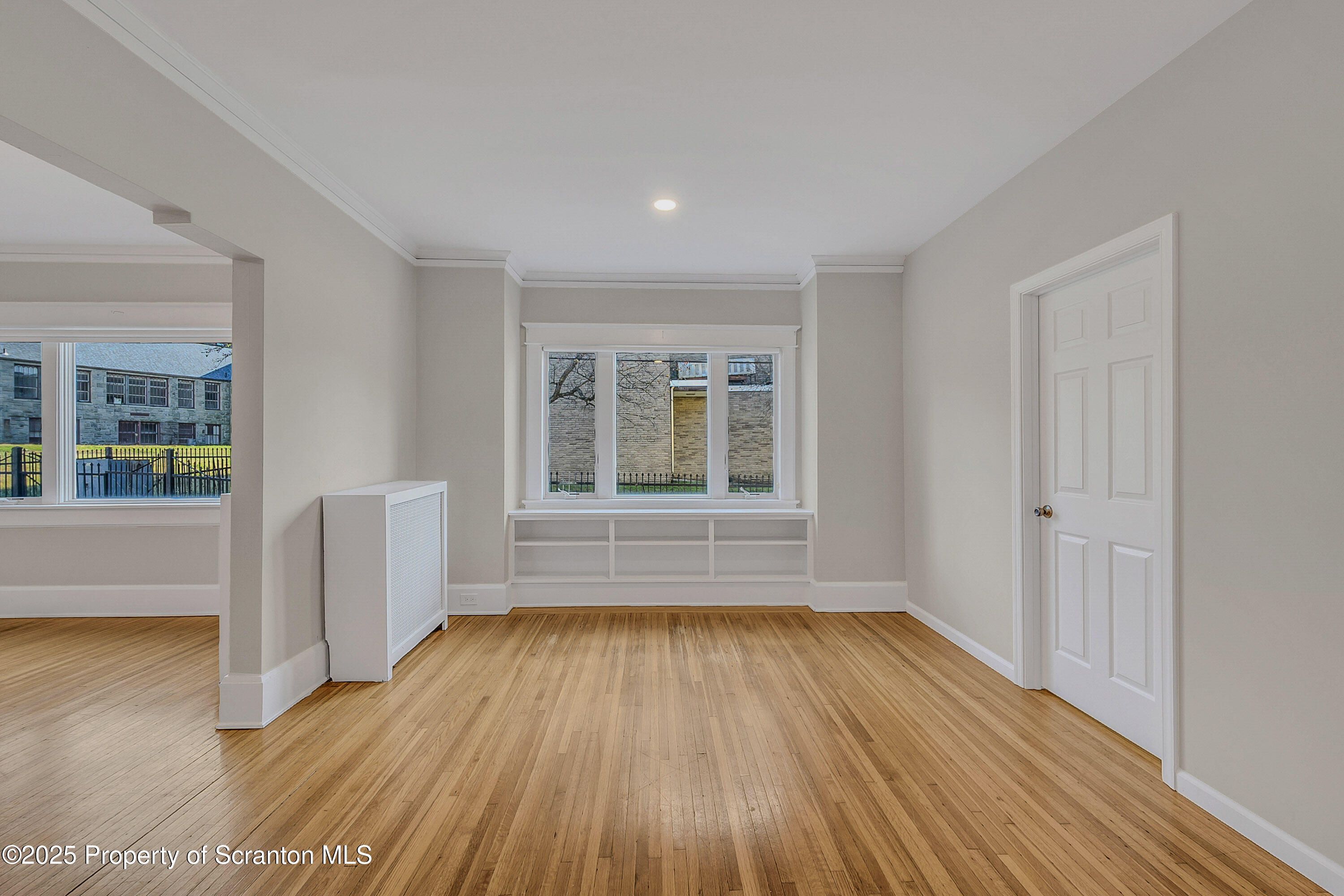 1900 North Washington Avenue, Unit 1 Scranton, PA 18509 - Photo 13 of 26 wooden floor in an empty room with a window