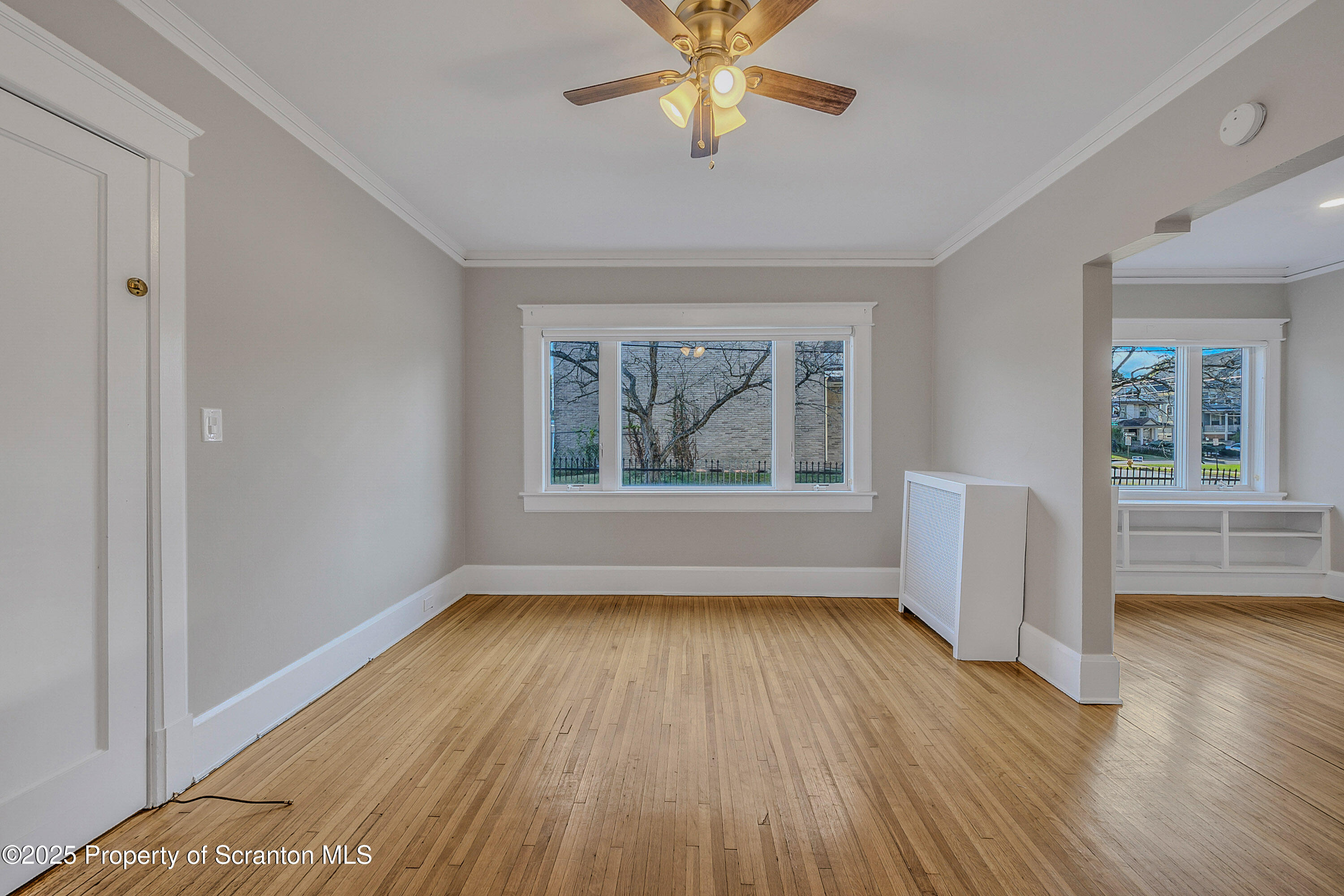 1900 North Washington Avenue, Unit 1 Scranton, PA 18509 - Photo 15 of 26 wooden floor in an empty room with a window