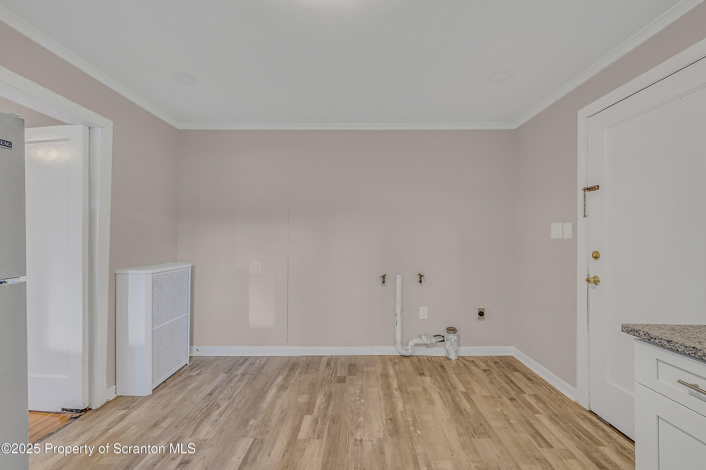 1900 North Washington Avenue, Unit 1 Scranton, PA 18509 - Photo 18 of 26 a view of an empty room with wooden floor and closet