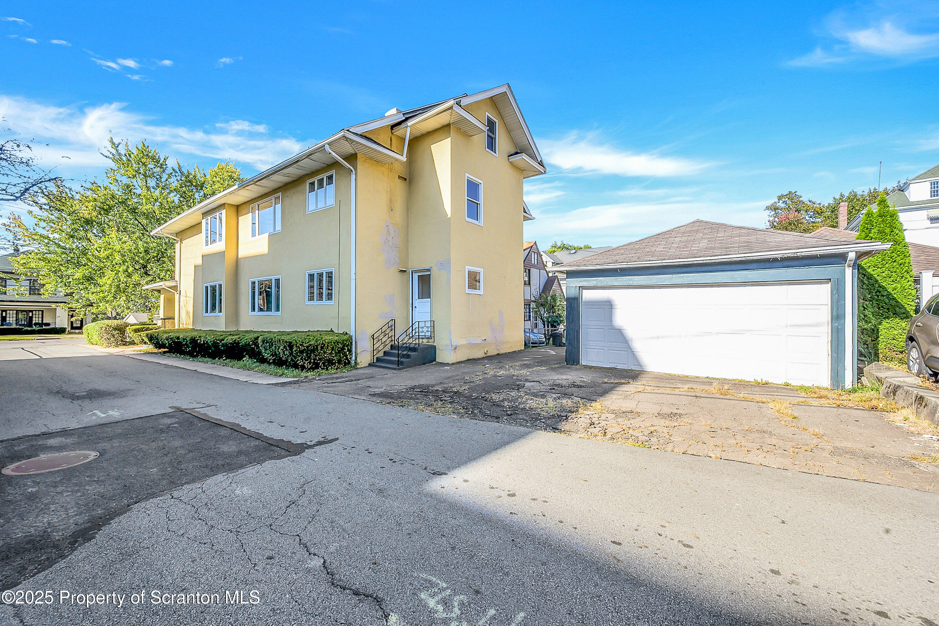1900 North Washington Avenue, Unit 1 Scranton, PA 18509 - Photo 2 of 26 a front view of a house with a yard