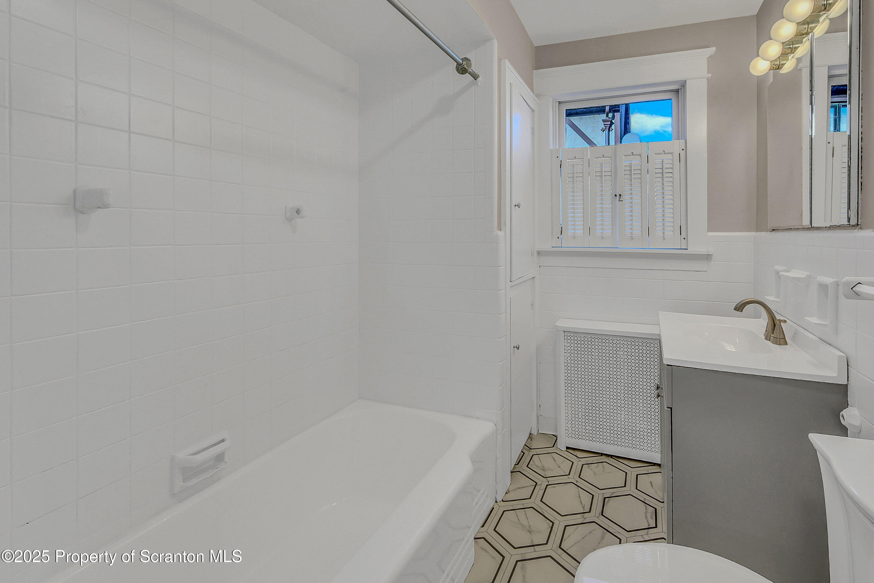 1900 North Washington Avenue, Unit 1 Scranton, PA 18509 - Photo 23 of 26 a bathroom with a sink a toilet and shower
