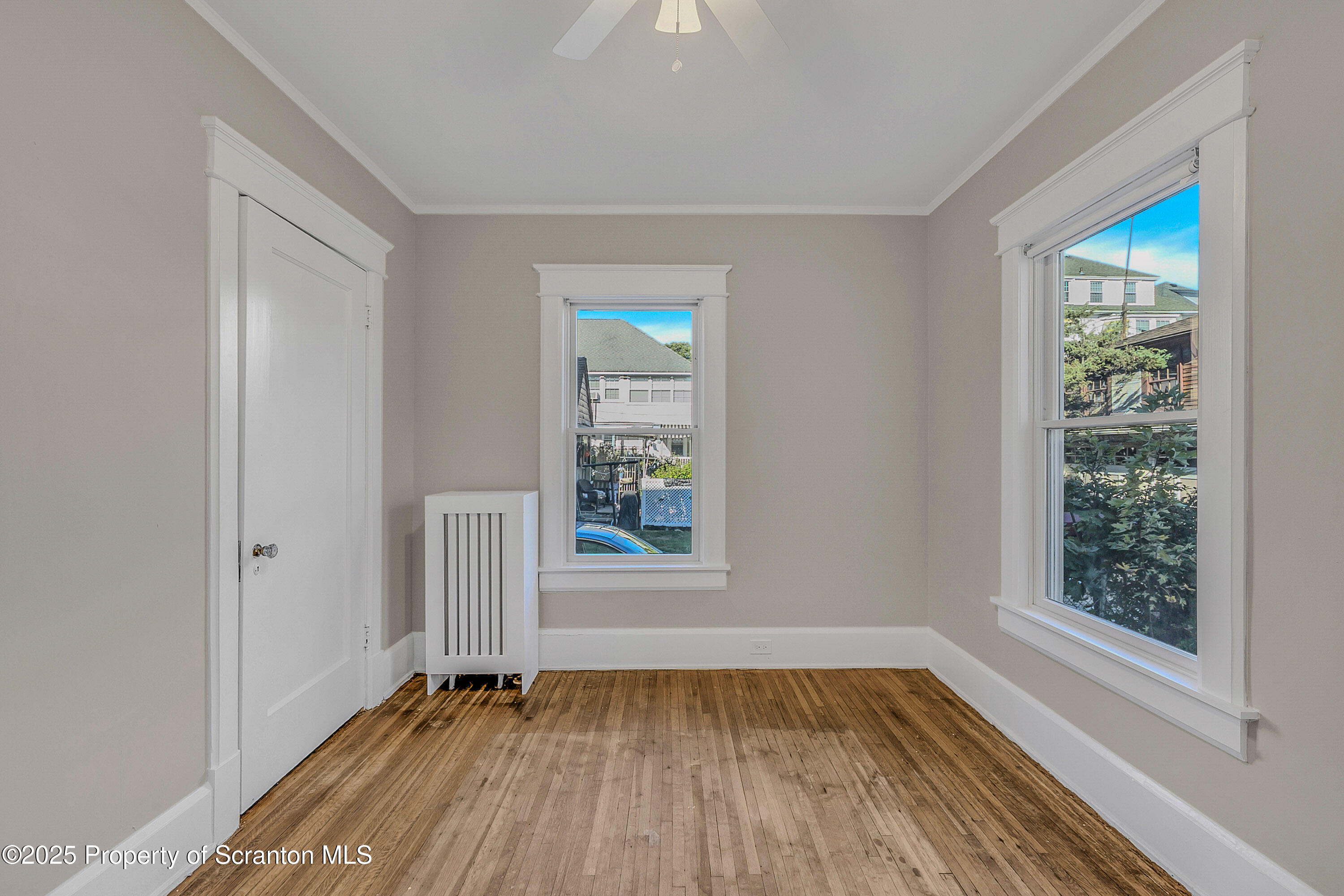1900 North Washington Avenue, Unit 1 Scranton, PA 18509 - Photo 24 of 26 an empty room with wooden floor and windows
