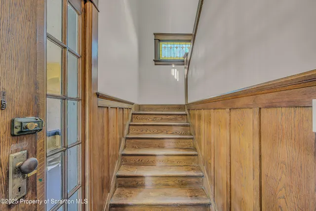 a view of entryway with wooden floor