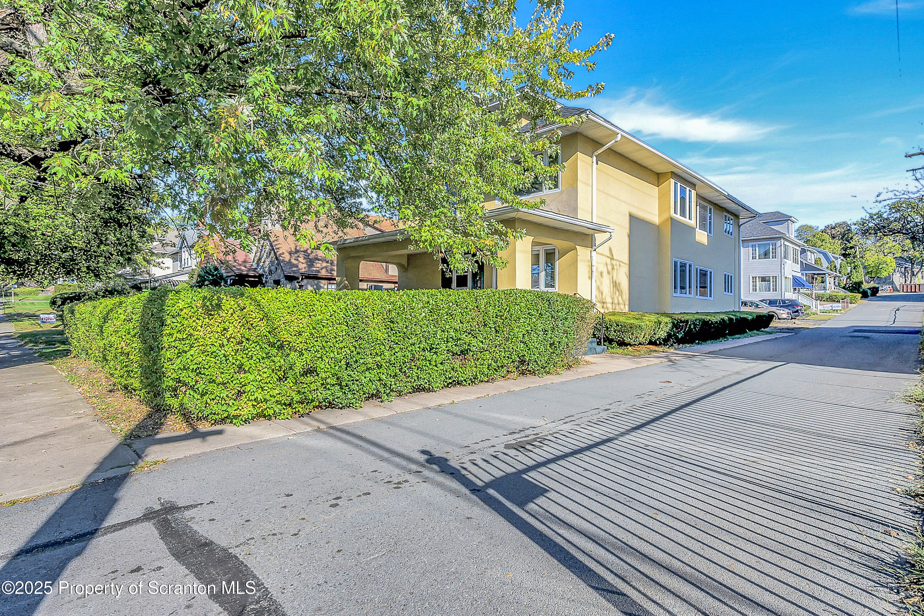 1900 North Washington Avenue, Unit 1 Scranton, PA 18509 - Photo 5 of 26 a front view of a house with a yard