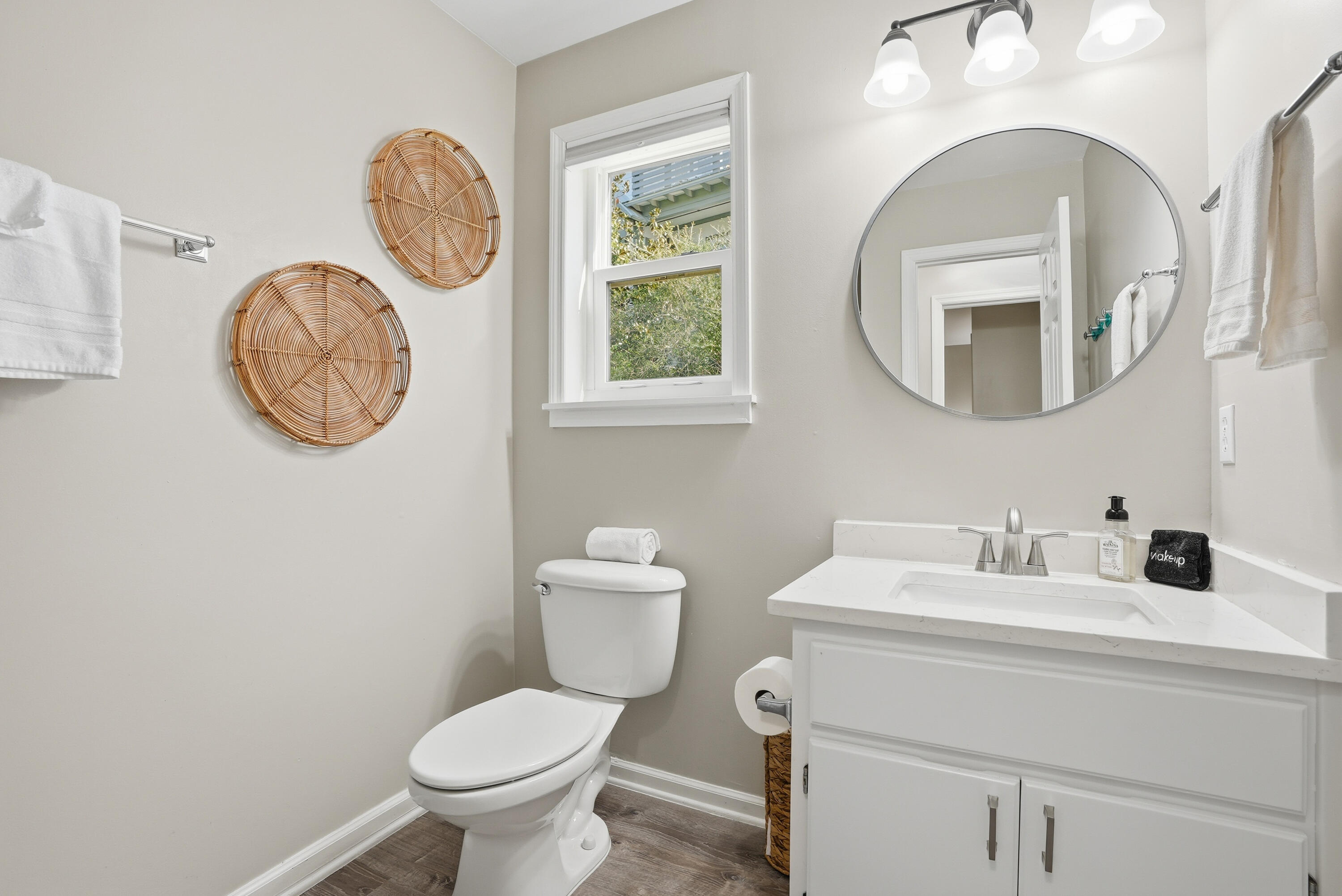 11 Beachside Drive, Unit 1214 Santa Rosa Beach, FL 32459 - Photo 17 of 28 a bathroom with a toilet a sink and a mirror