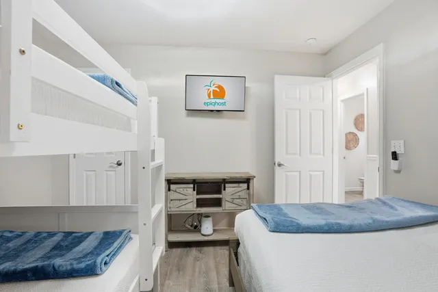 a bedroom with a bed and a dresser