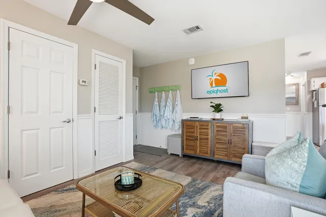a living room with furniture and a flat screen tv