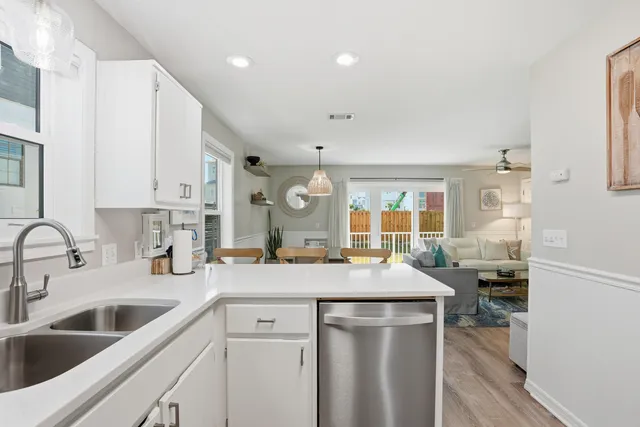 a kitchen with a sink stove and microwave