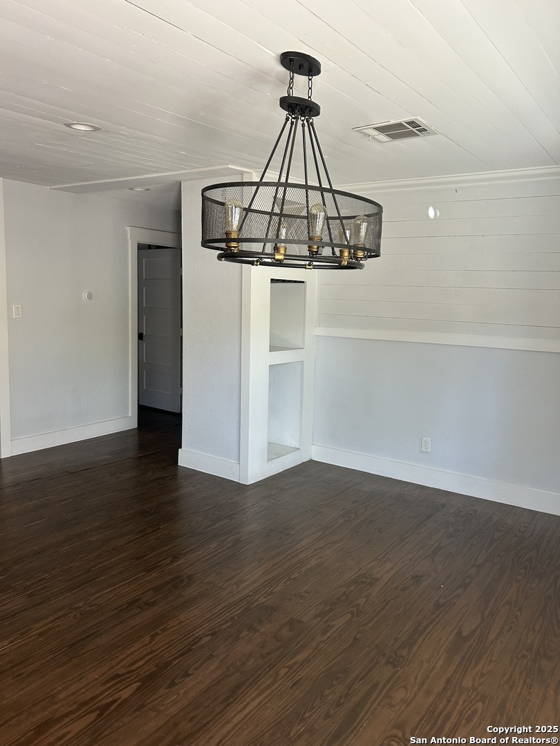 136 Phil Wilson Boerne, TX 78006 - Photo 2 of 7 a view of a room with wooden floor a ceiling fan and table