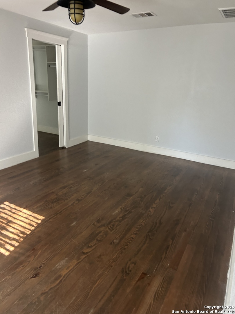 136 Phil Wilson Boerne, TX 78006 - Photo 4 of 7 a view of an empty room with wooden floor and a window