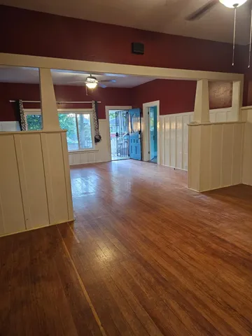 a view of gallery with wooden floor