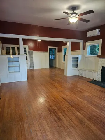a view of a livingroom with a kitchen and a stove top oven