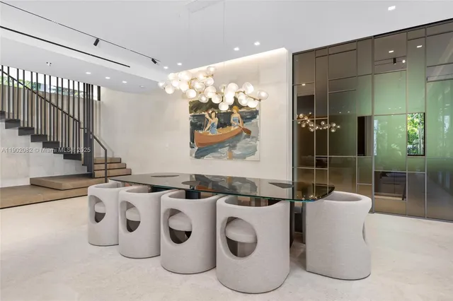 a kitchen with stainless steel appliances granite countertop a sink a stove and a refrigerator