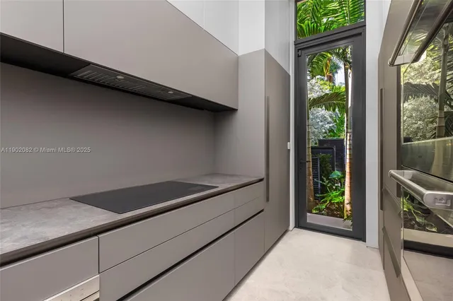 a spacious bedroom with a bed and glass window