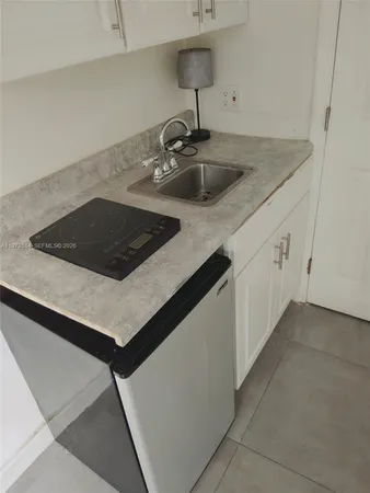 a bathroom with a sink and mirror