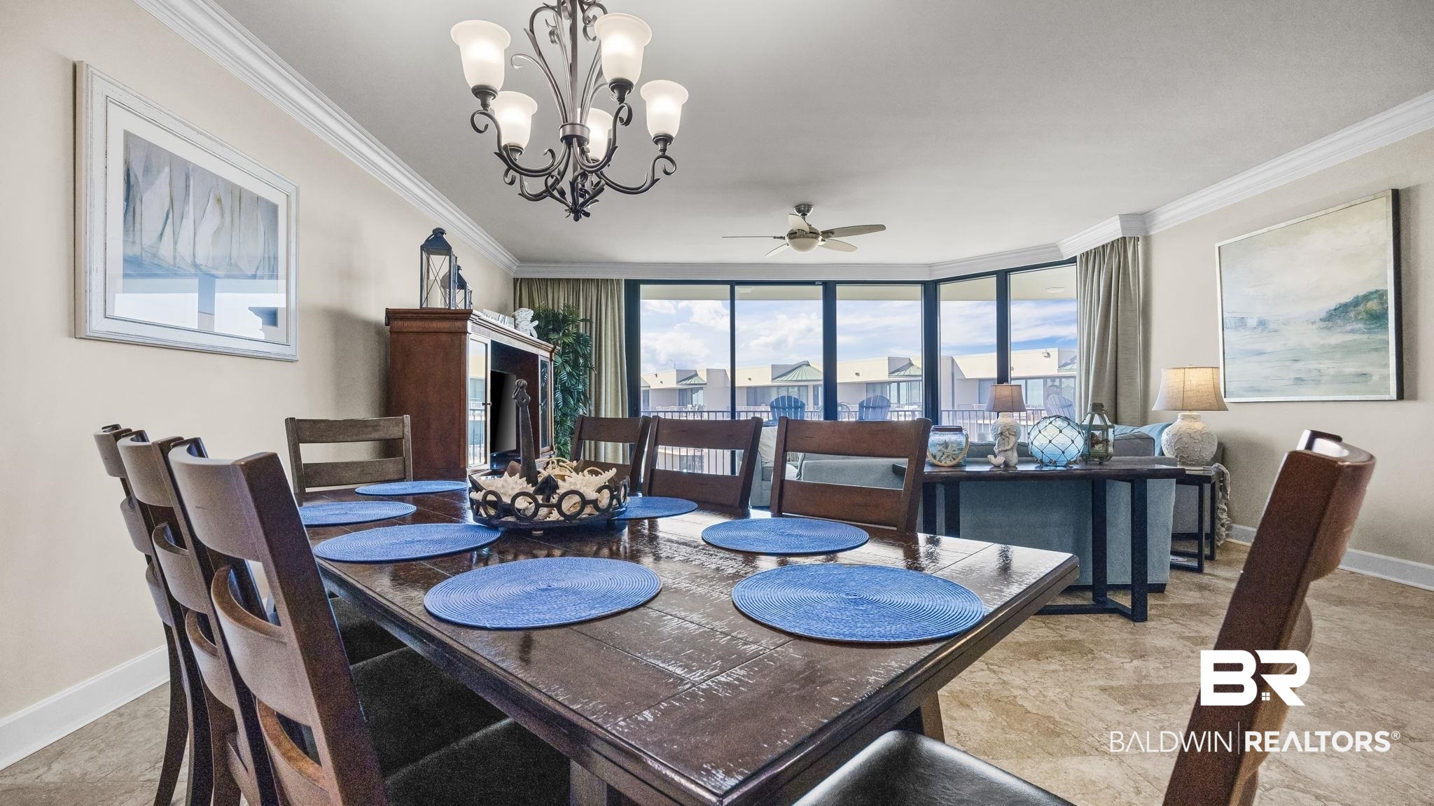 27580 Canal Road, Unit 1526 Orange Beach, AL 36561 - Photo 13 of 49 Dining space featuring crown molding, a chandelier, ceiling fan, and expansive windows