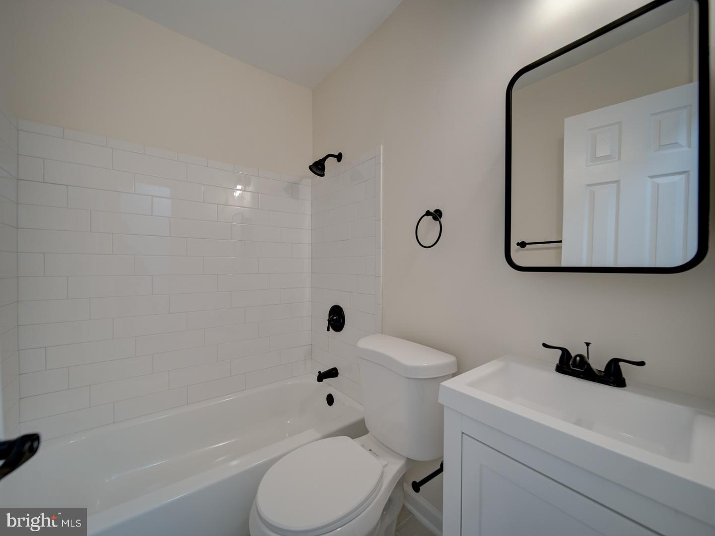 1946 I Street Northeast Washington, DC 20002 - Photo 13 of 47 a bath room with a toilet a sink and a bath tub