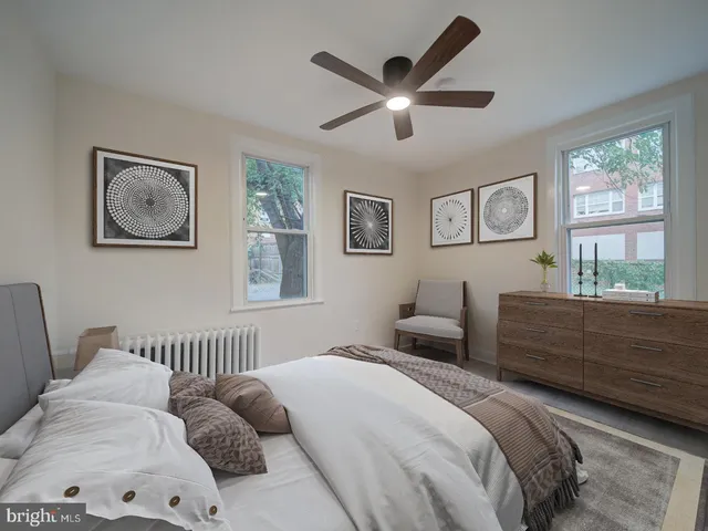 a bedroom with a large bed and a window