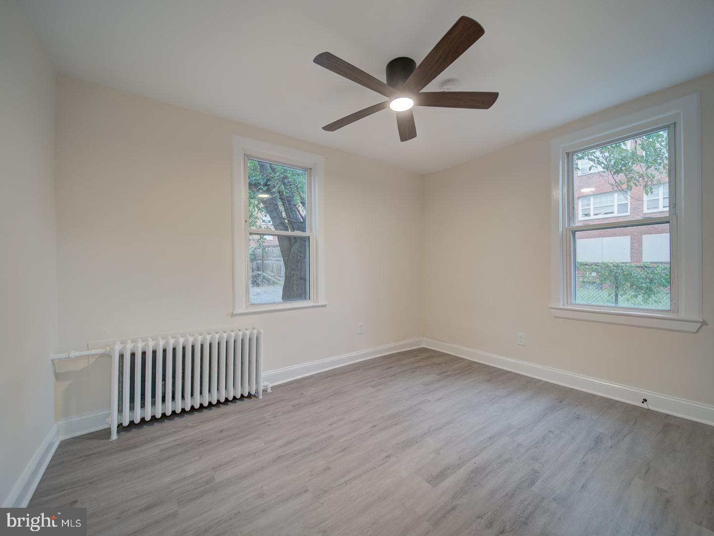 1946 I Street Northeast Washington, DC 20002 - Photo 19 of 47 wooden floor in an empty room with a window