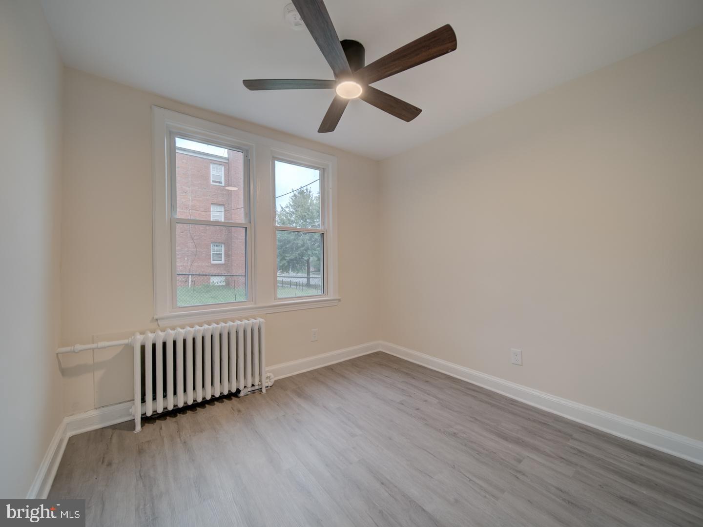 1946 I Street Northeast Washington, DC 20002 - Photo 23 of 47 wooden floor in an empty room with a window