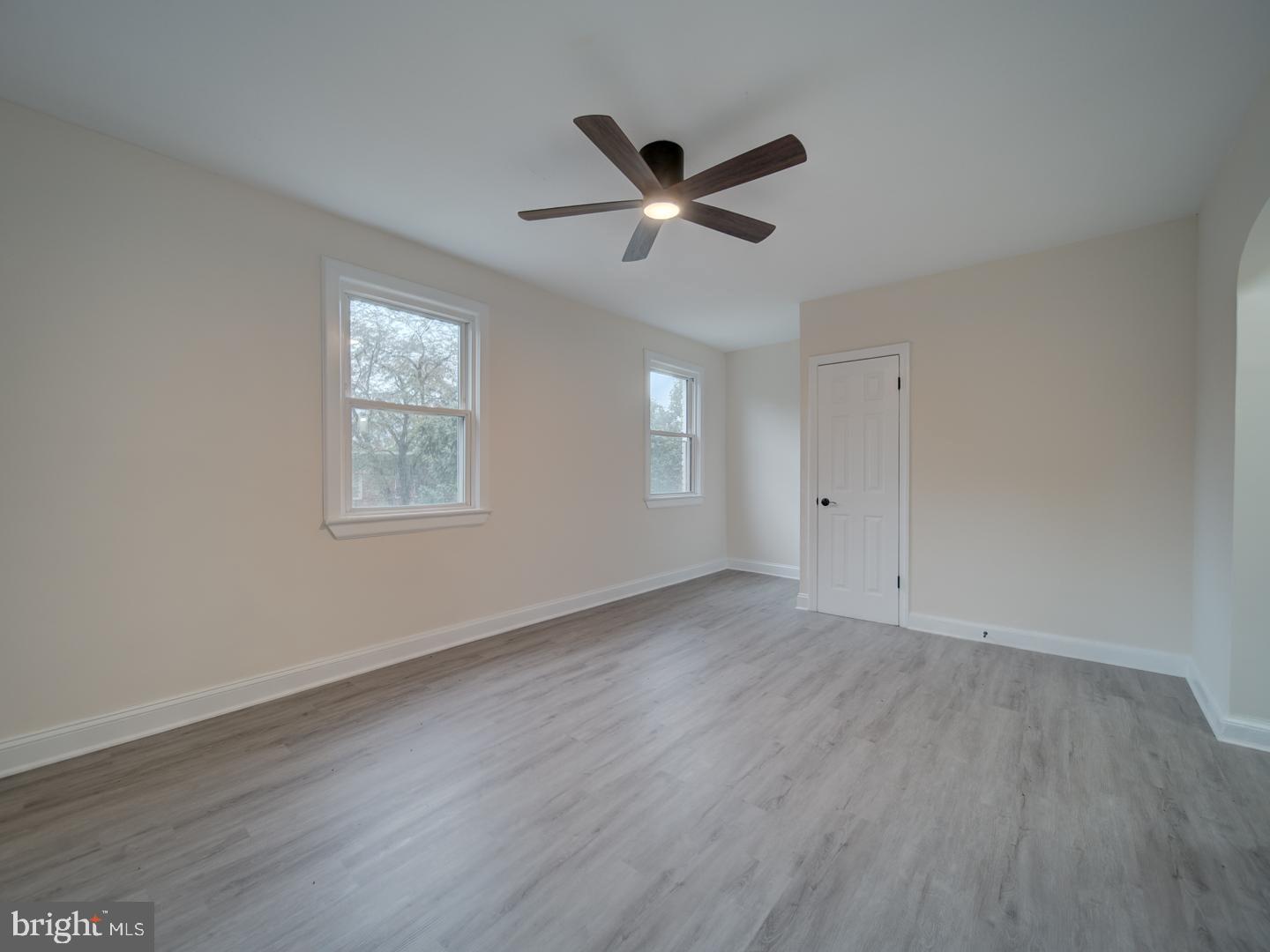 1946 I Street Northeast Washington, DC 20002 - Photo 29 of 47 a view of an empty room with wooden floor and a window