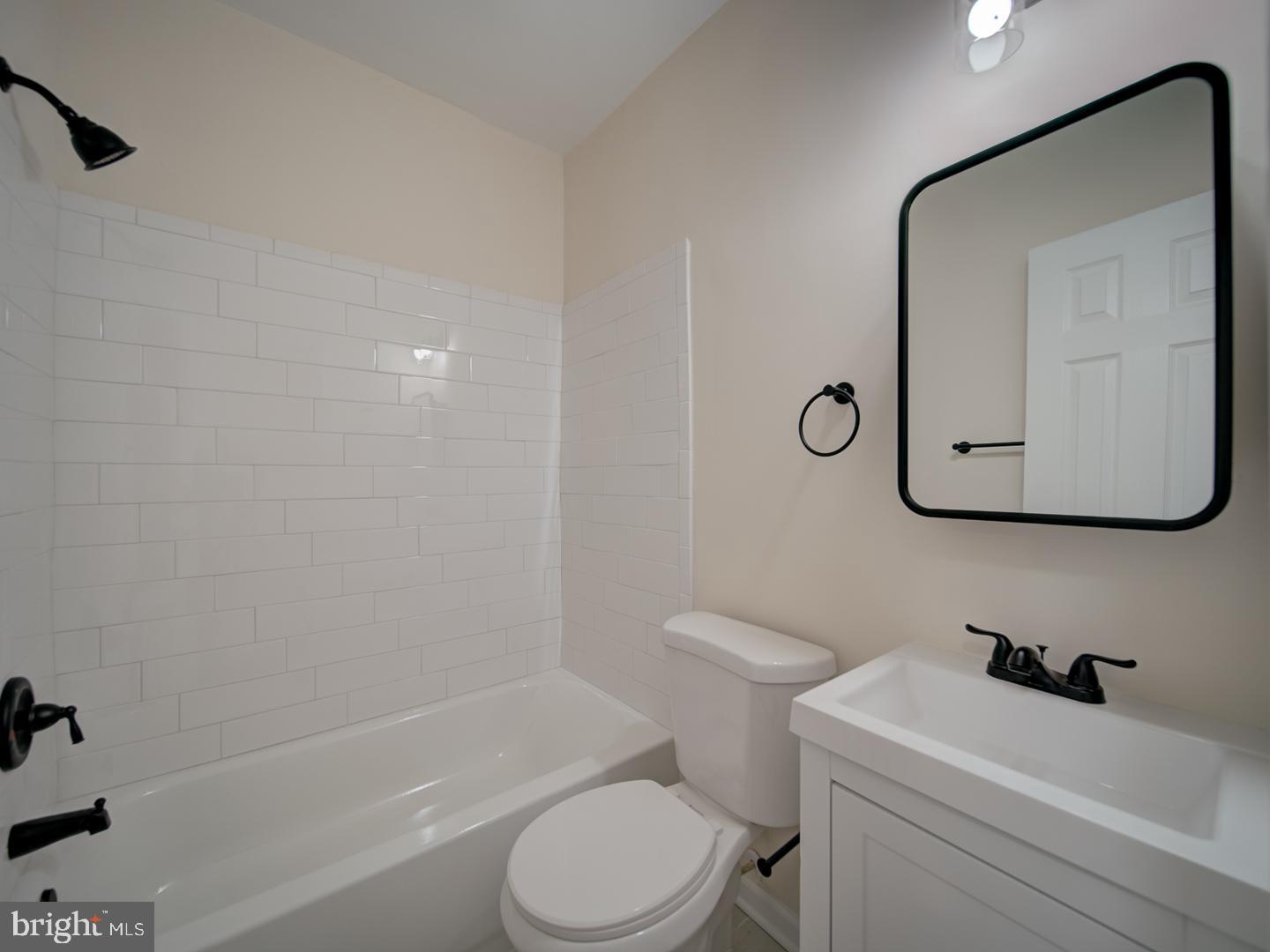 1946 I Street Northeast Washington, DC 20002 - Photo 35 of 47 a bathroom with a toilet sink and mirror