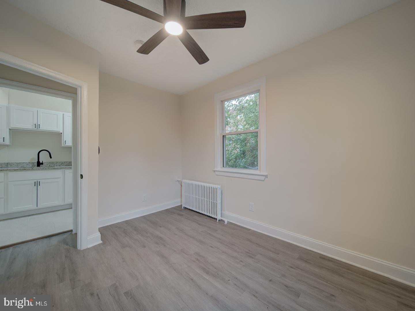 1946 I Street Northeast Washington, DC 20002 - Photo 41 of 47 wooden floor in an empty room with a window