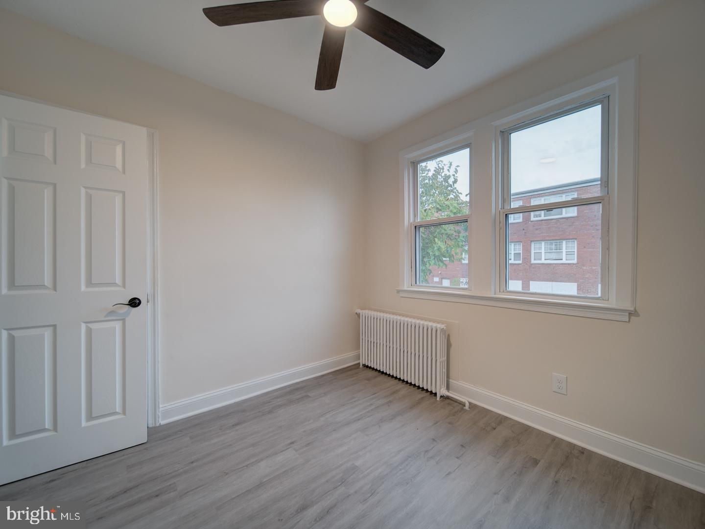 1946 I Street Northeast Washington, DC 20002 - Photo 46 of 47 a view of an empty room with wooden floor and window