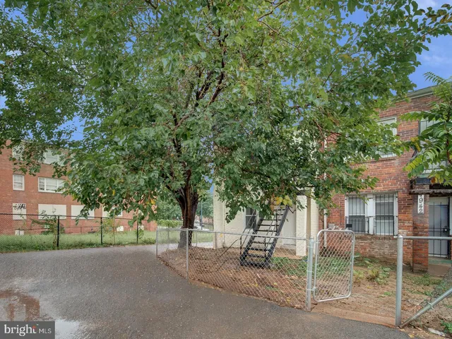 a view of a house with a tree