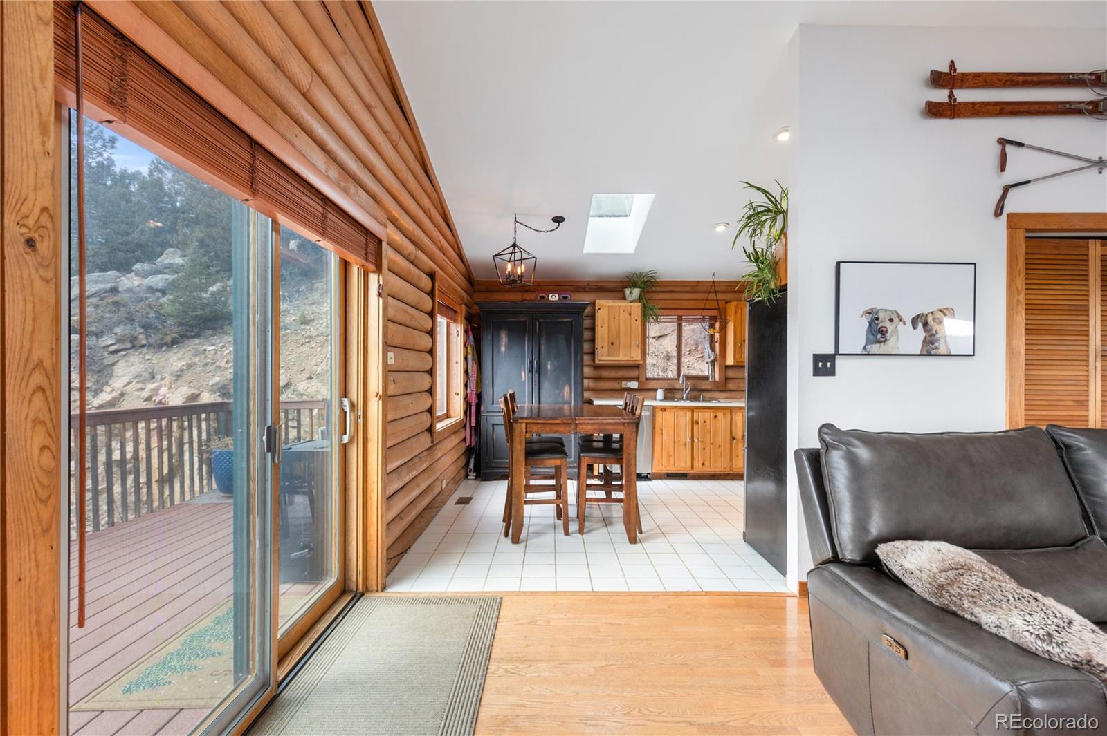 10221 Blue Sky Trail Conifer, CO 80433 - Photo 12 of 37 a living room with furniture and a fireplace