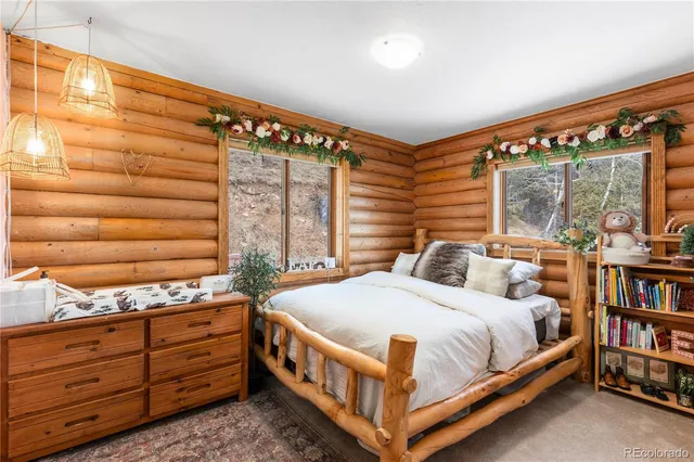 a bedroom with a bed closet and window