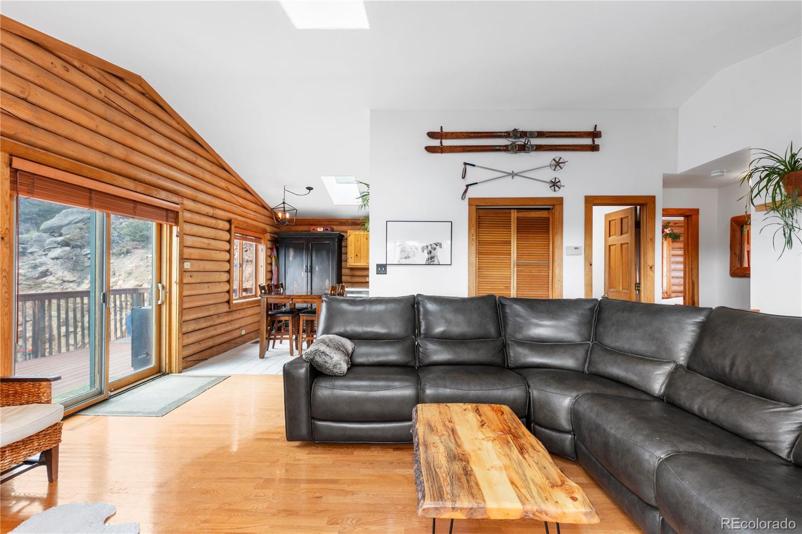10221 Blue Sky Trail Conifer, CO 80433 - Photo 6 of 37 a living room with furniture and a large window