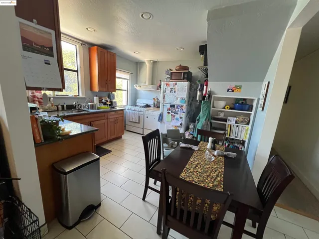 a very nice looking dining room with furniture