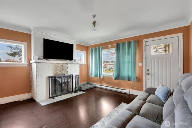 a living room with furniture and a flat screen tv